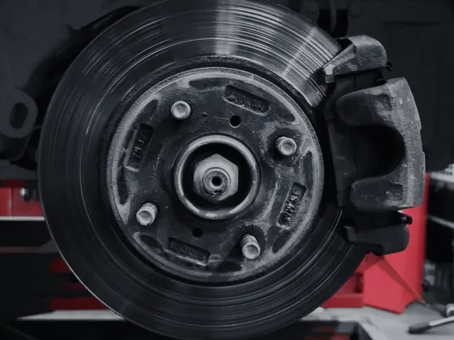 Brake rotor and caliper on a shop lift
